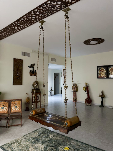 Traditional jhoola as a unique drawing room decoration element with elegant wooden craftsmanship and classic interior décor